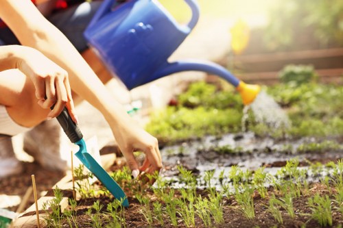 Gardener preparing tools on site at the start of work